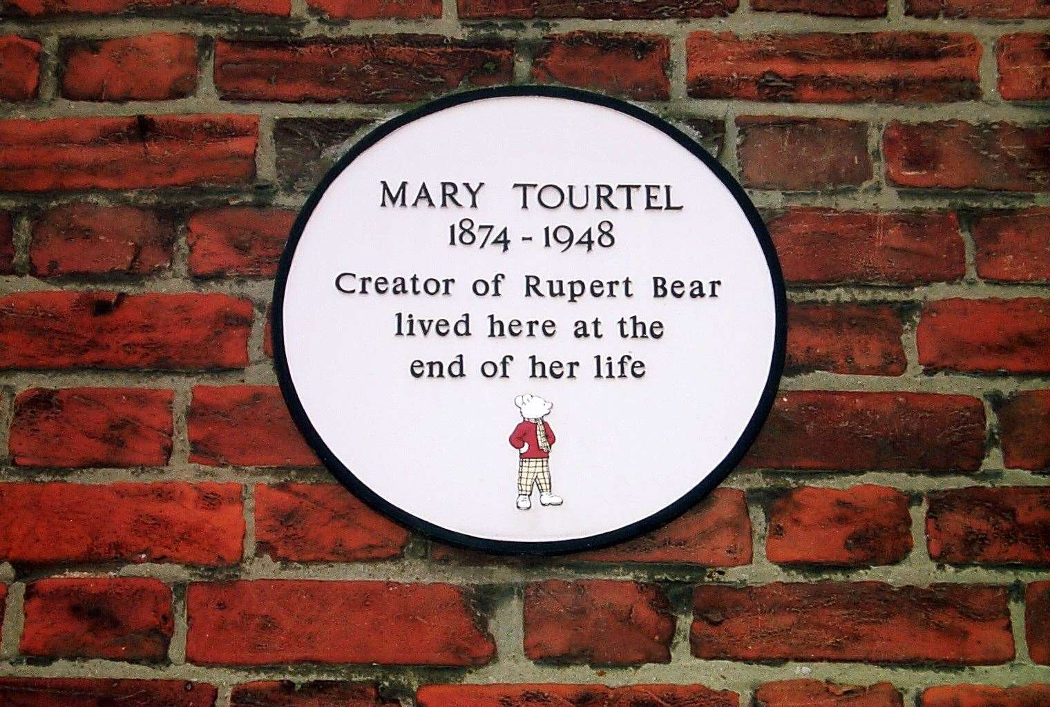The plaque on the side of the Chaucer Hotel in Canterbury where Mary Tourtel spent her final months